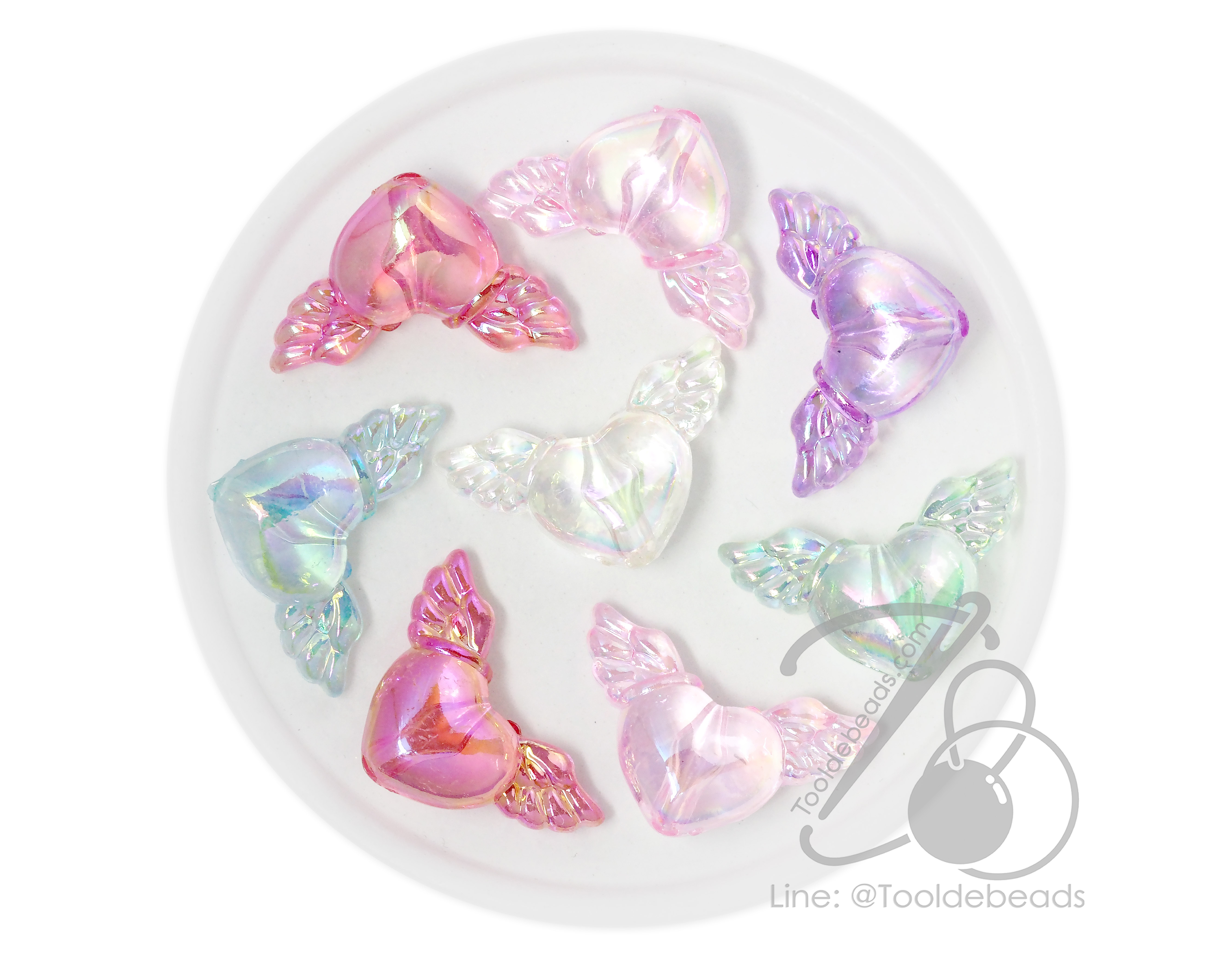 ลูกปัดพลาสติก เคลือบรุ้งAB 20*34มม. ลายหัวใจติดปีก คละสีรุ้งใส (10 กรัม) SKU-17796