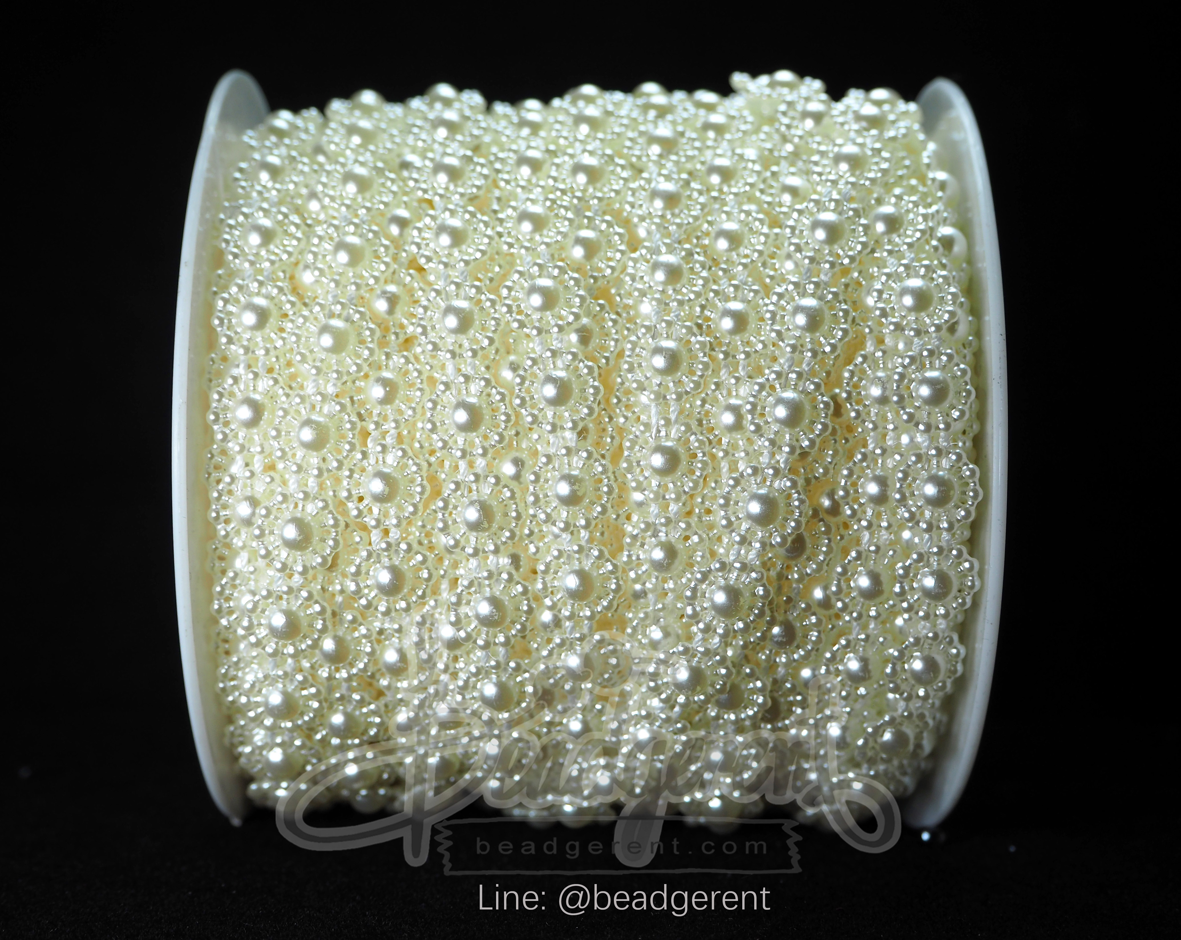 มุกเส้น 11มม. ลายมุกล้อม11จุด สีครีม (25 หลา) SKU-01849
