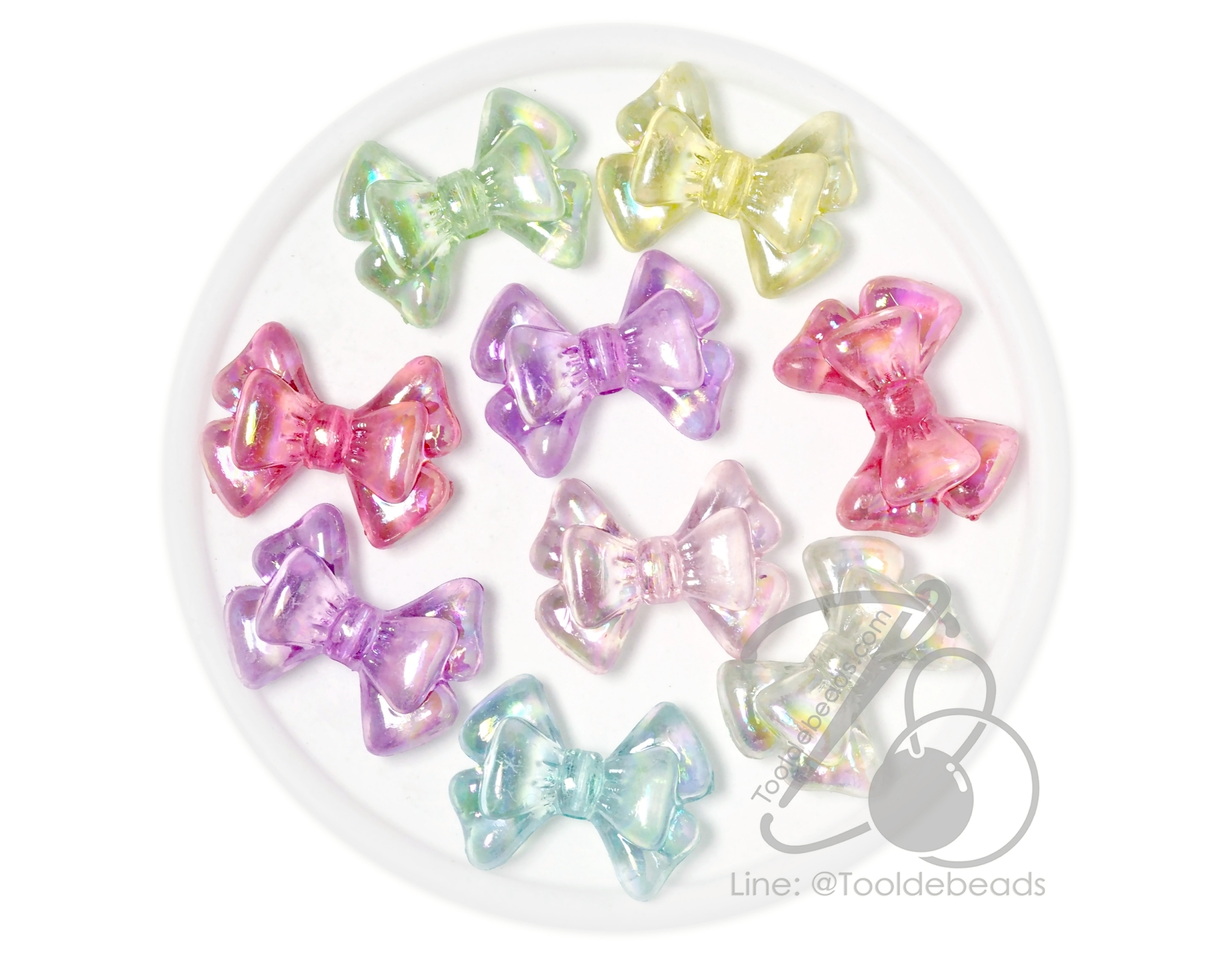 ลูกปัดพลาสติก เคลือบรุ้งAB 21*28มม. ลายโบว์ซ้อน คละสีรุ้งใส (80 กรัม) SKU-17990