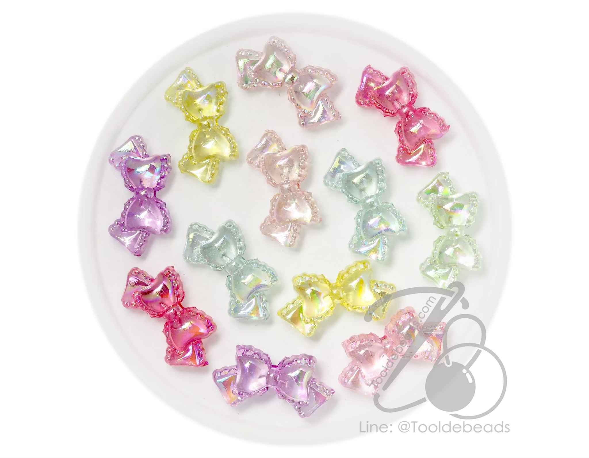 ลูกปัดพลาสติก เคลือบรุ้งAB 14*27มม. ลายโบว์สวย คละสีรุ้งใส (500 กรัม) SKU-17997