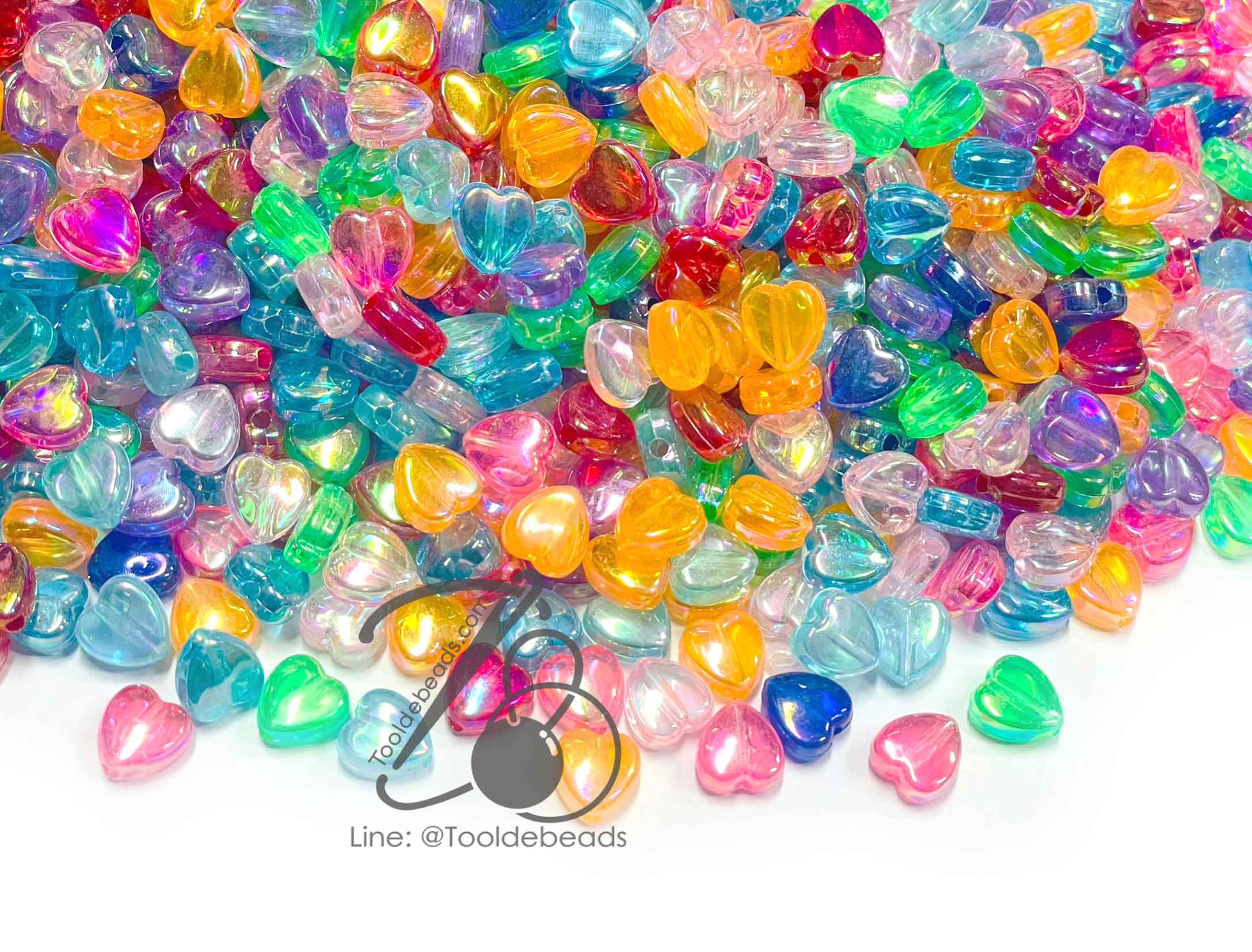 ลูกปัดพลาสติก เคลือบรุ้ง 9มม. ลายหัวใจ คละสีรุ้งใส (500 กรัม) SKU-12909