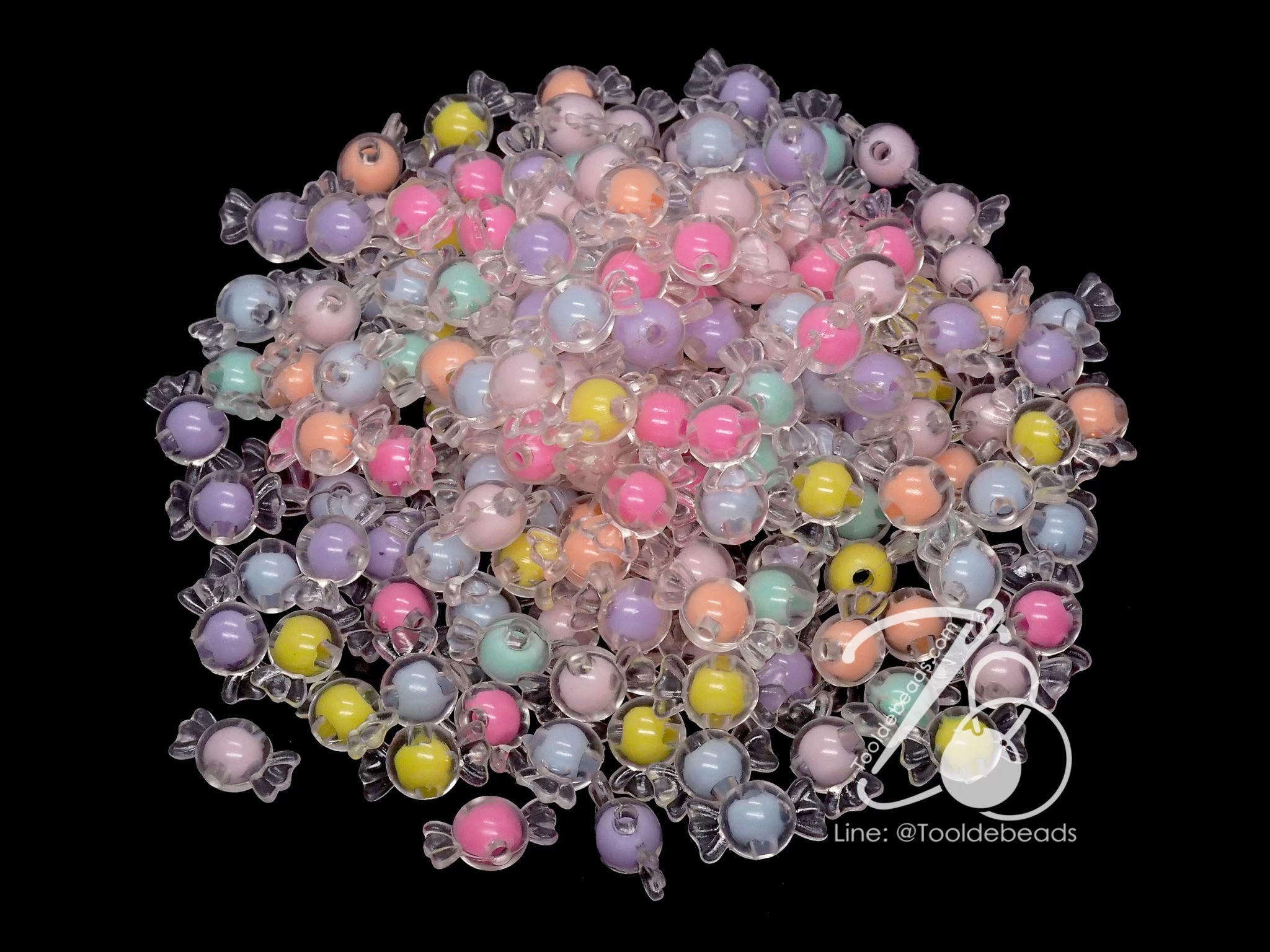 ลูกปัดอะคริลิค 21*12มม. ลายทอฟฟี่สอดไส้ คละสีใส (10 กรัม) SKU-12737