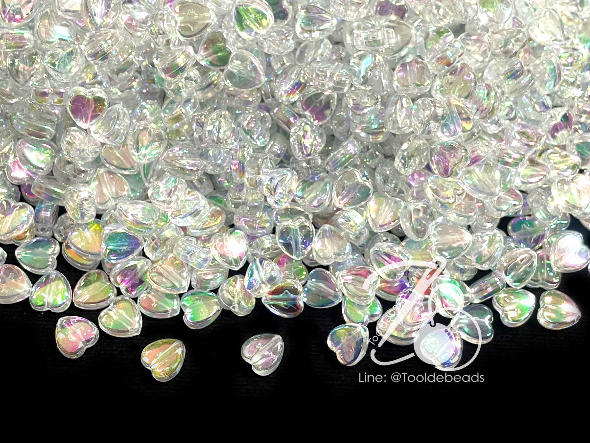 ลูกปัดพลาสติก เคลือบรุ้ง 9มม. ลายหัวใจ สีขาวรุ้งใส (500 กรัม) SKU-12891