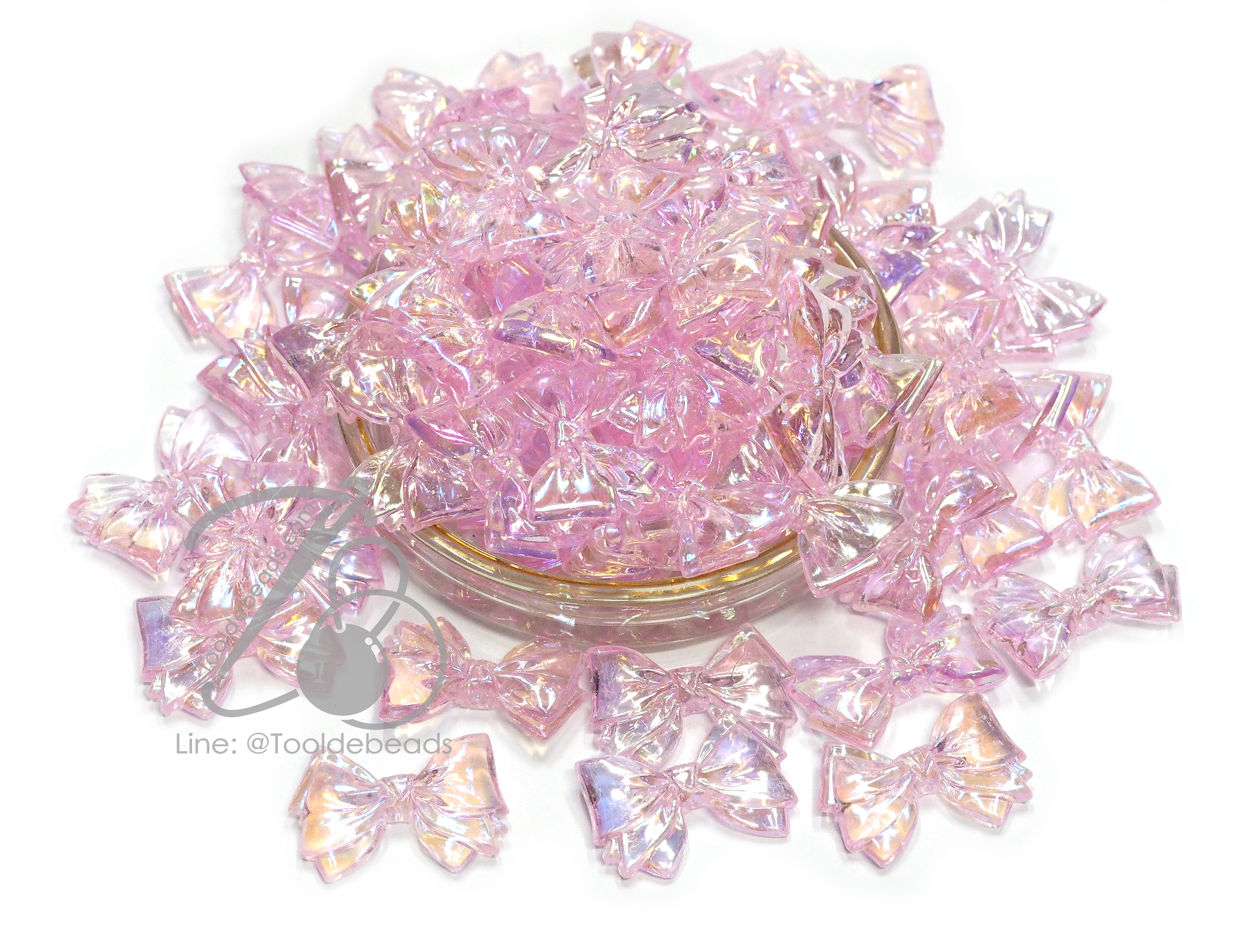 ลูกปัดพลาสติก เคลือบรุ้ง 20*30มม. ลายโบว์มีหาง สีชมพูรุ้งใส (80 กรัม) SKU-14481